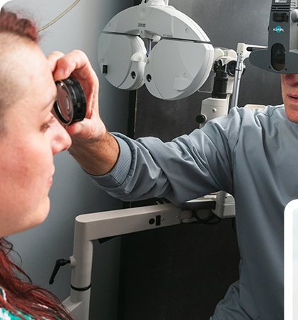 Optometrist examining a patient with a phoropter